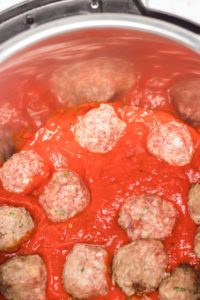 This Instant Pot Spaghetti and Meatballs Recipe is a delicious one-pot meal that the entire family will love. This delicious dinner will be ready in under 30 minutes!