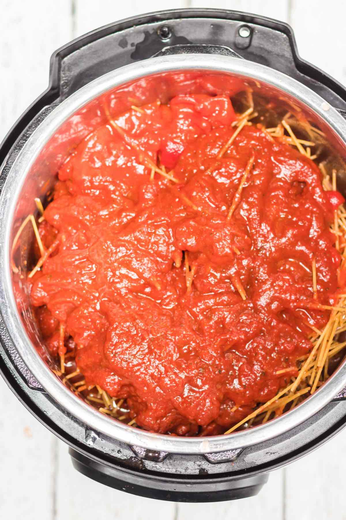 This instant pot spaghetti and meatballs is an easy one-pot recipe with mouth-watering homemade meatballs.