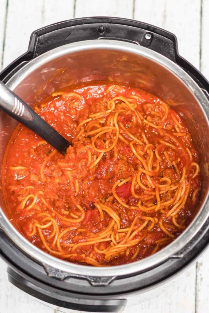 This Instant Pot Spaghetti and Meatballs Recipe is a delicious one-pot meal that the entire family will love. This delicious dinner will be ready in under 30 minutes!
