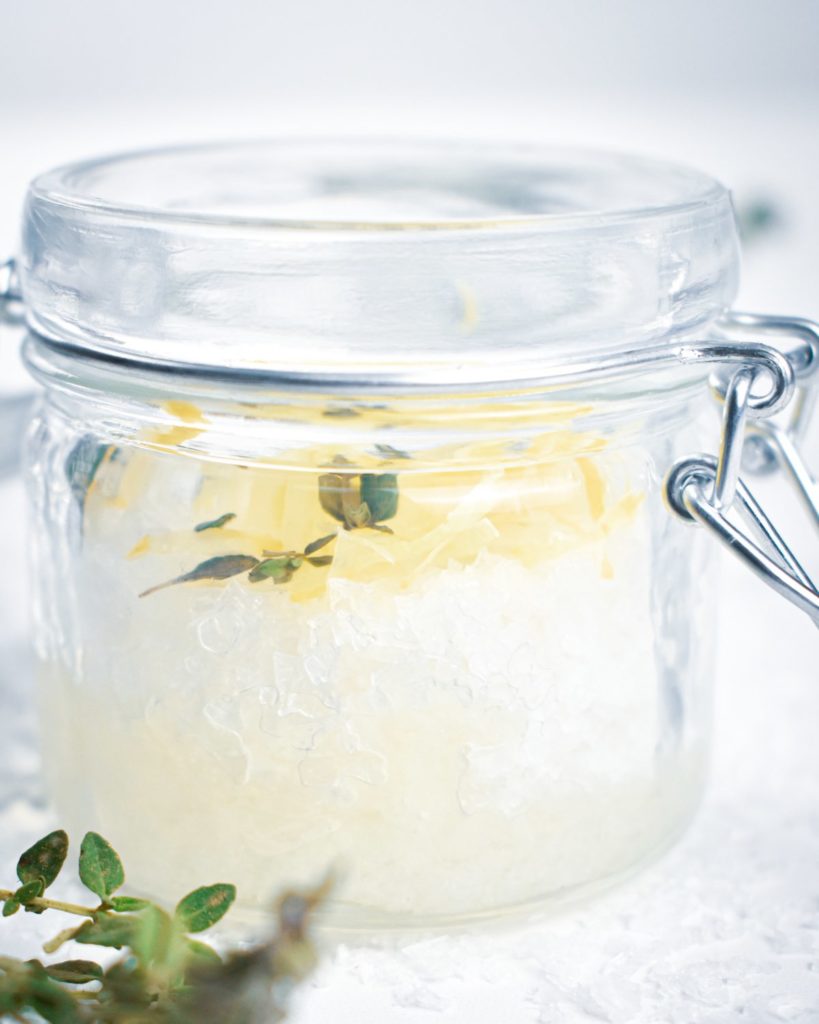 Make this homemade DIY lemon thyme salt scrub with just 4 ingredients for glowing skin. Gently exfoliate, nourish and moisturize skin.