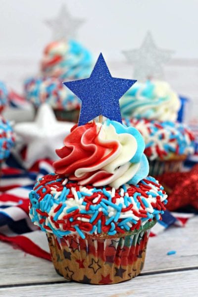 Patriotic Red, White and Blue Cupcakes - This easy to make festive cupcake recipe is perfect for celebrating 4th of July festivities and even Memorial Day. These cupcakes are soft, tasty and easy to make. These yummy 4th of July treats will become your favorite July 4th dessert. #4thofjuly #july4th