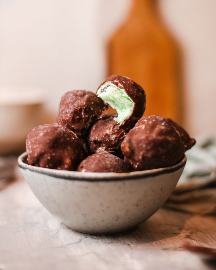 These Mint Chip Ice Cream Bon Bons are homemade ice cream bites covered with chocolate and way better than the ones in the freezer aisle.