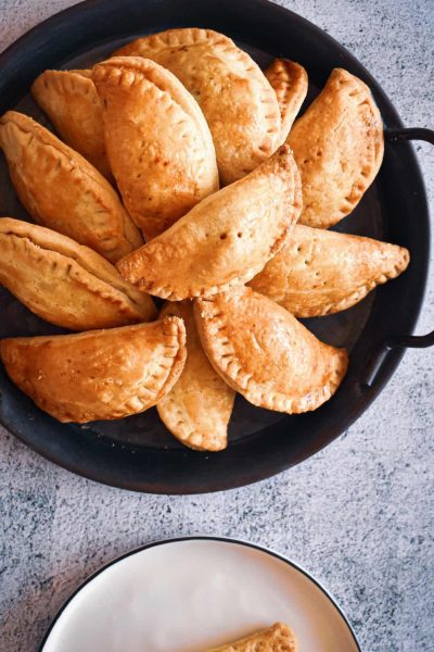 Nigerian Meat Pie is one of, if not, the most popular snack in Nigeria. It is the perfect intersection of buttery, crispy, shortcrust pastry filled with juicy minced beef and vegetable filling.