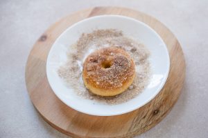baked pumpkin donut with cinnamon sugar coating