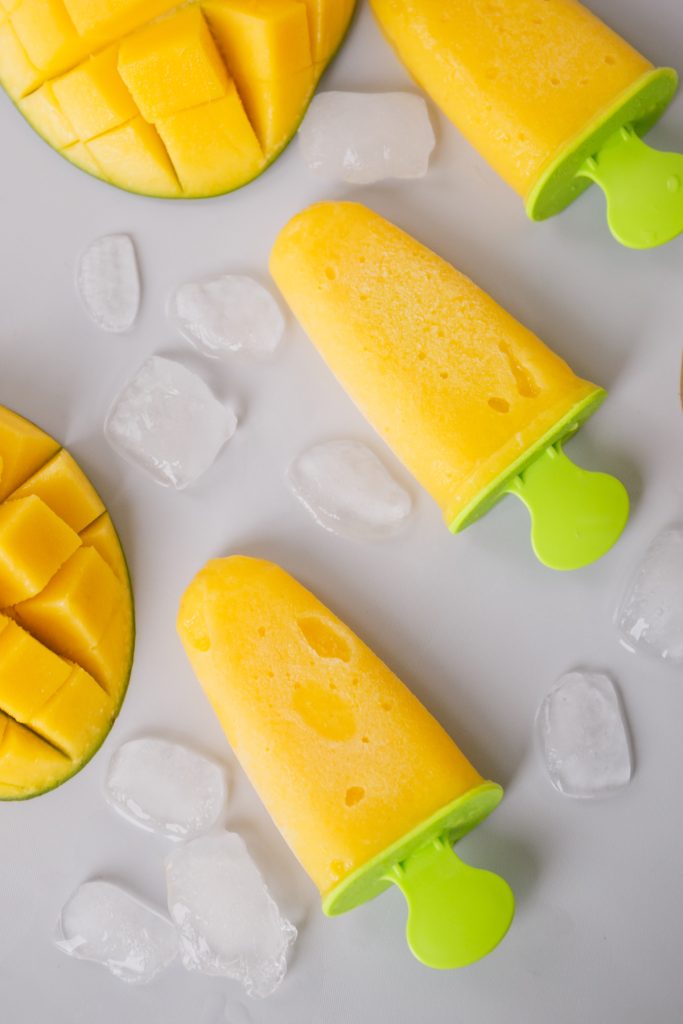creamy mango popsicles
