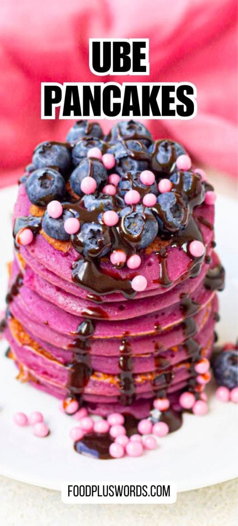 Ube pancakes on a plate with purple icing.