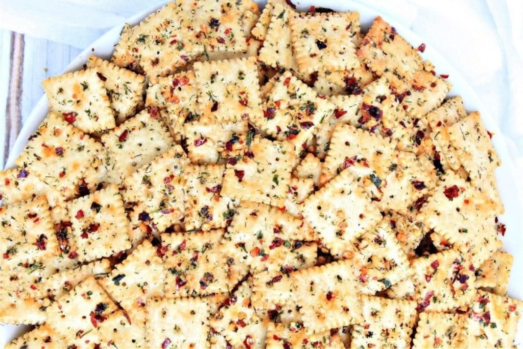A plate of crackers on a white table.