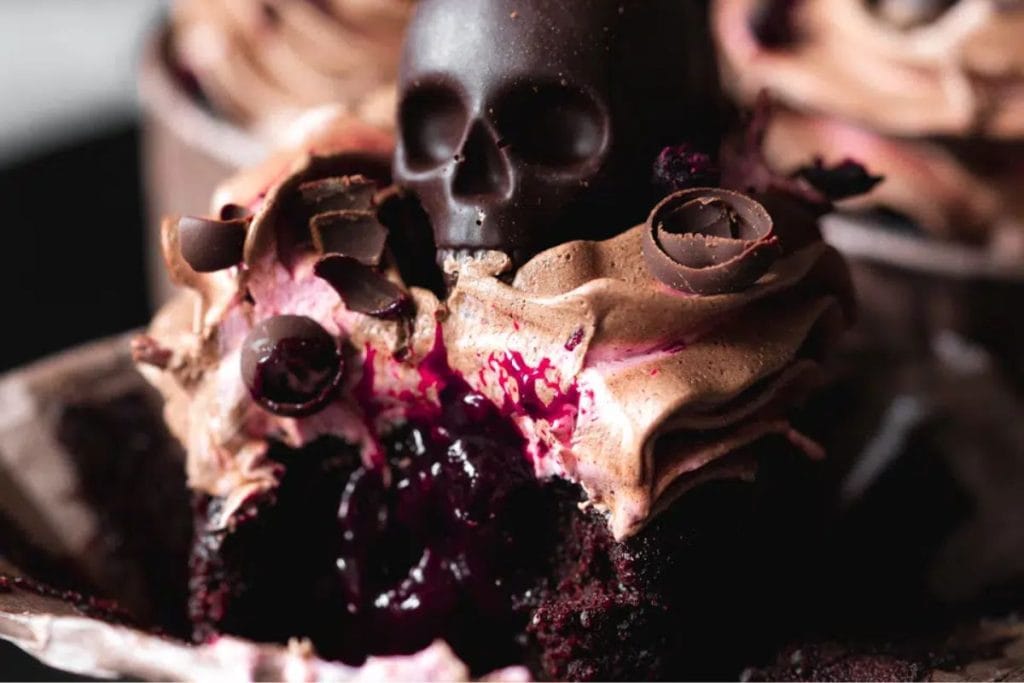 Chocolate cupcakes with a skull on top.