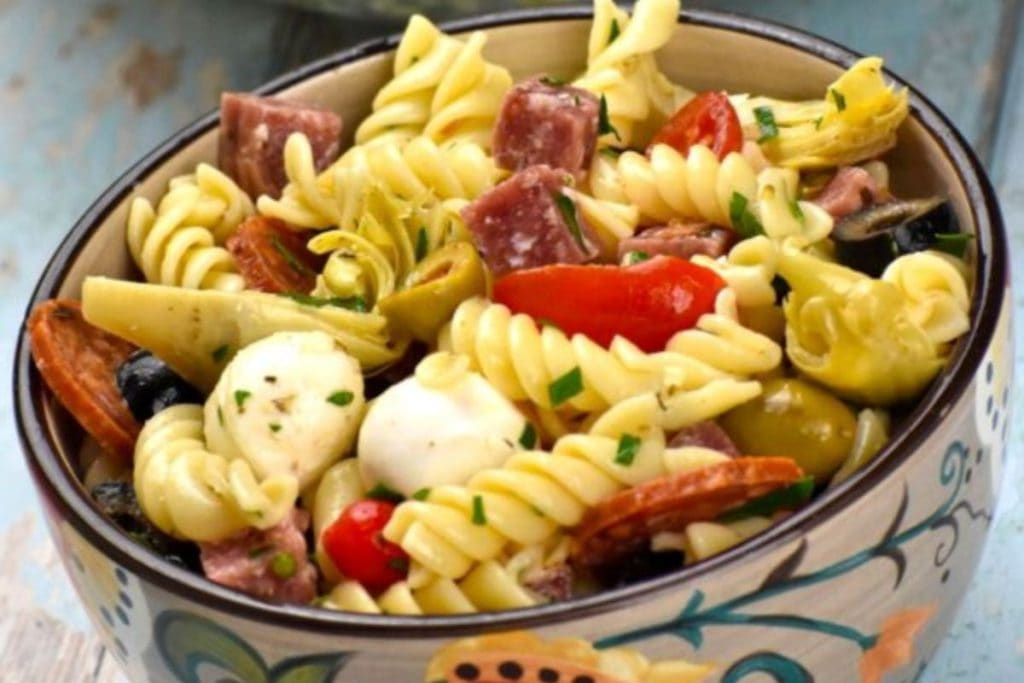 Last-Minute Potluck Ideas: A bowl of pasta salad with meat and vegetables.