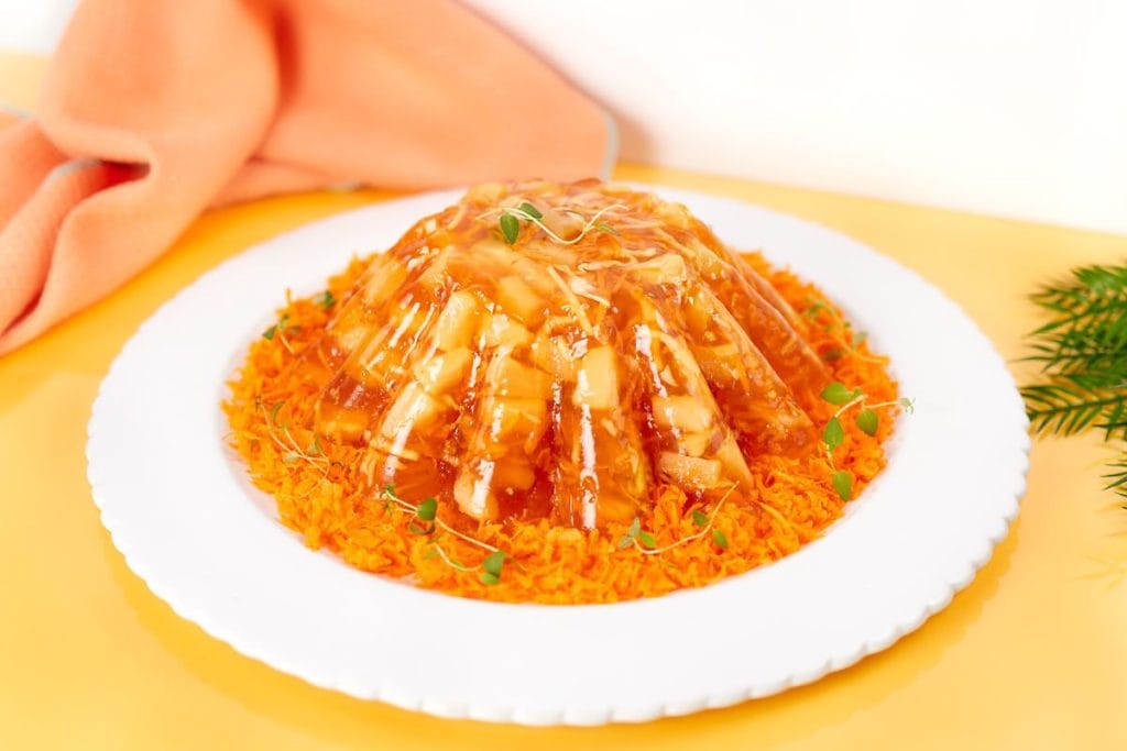 Last-Minute Potluck Ideas: A plate of orange rice with a sauce on it.