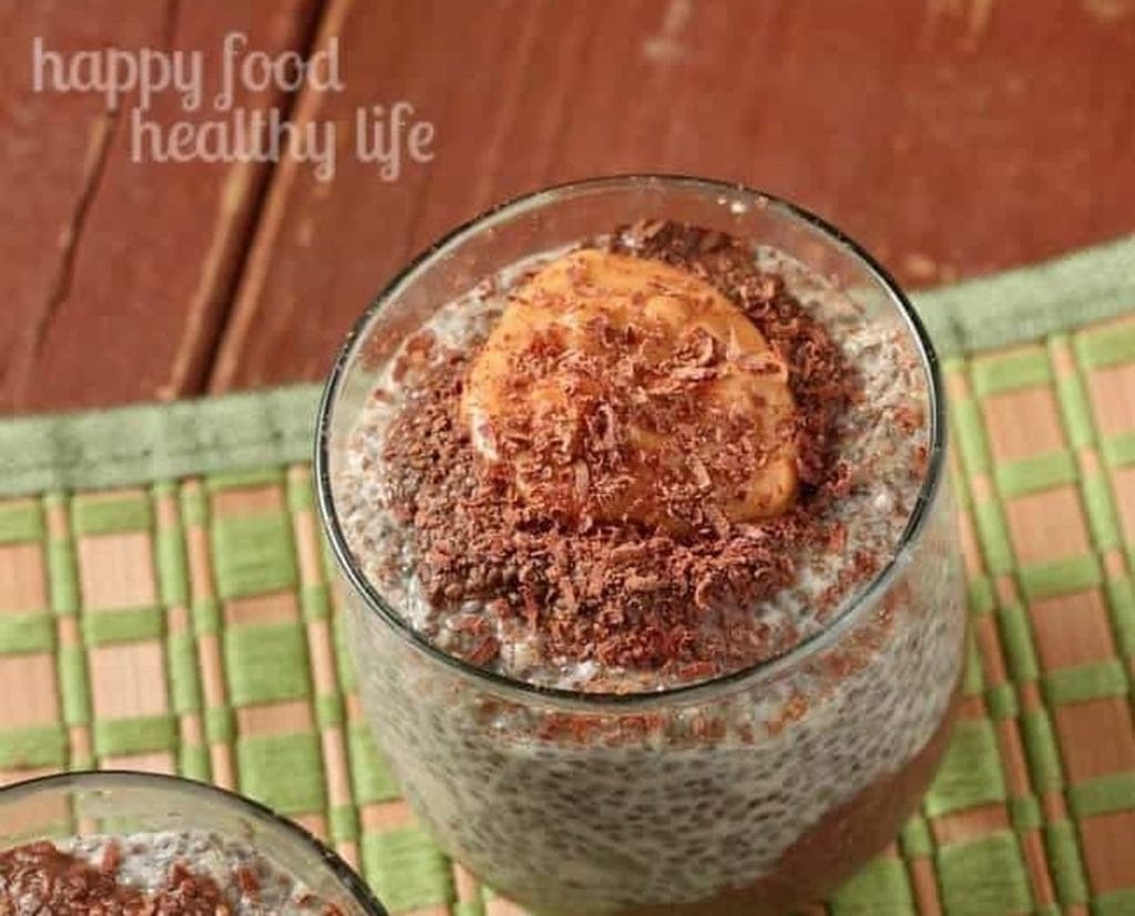 Two glasses of chia pudding with chocolate on top.