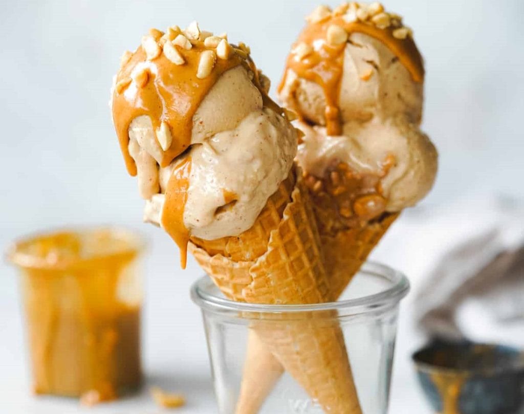 Two ice cream cones with peanut butter ice cream.