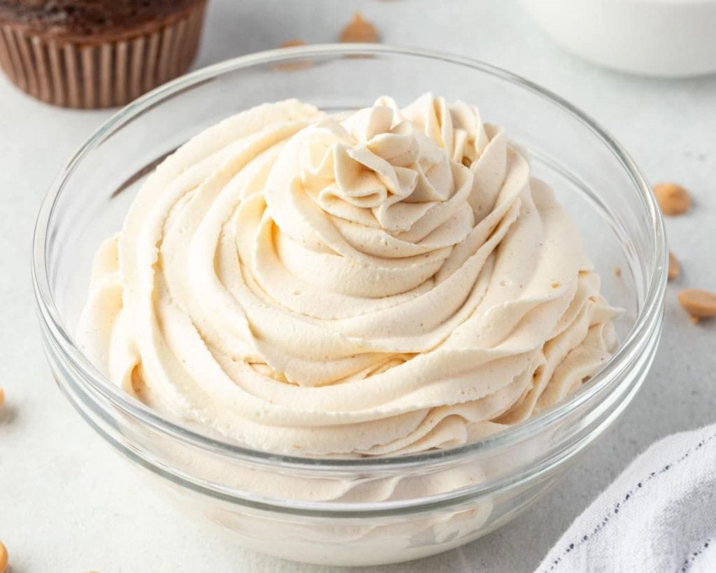 Celebrate National Peanut Butter Lovers' Day with this delicious peanut butter frosting in a glass bowl.