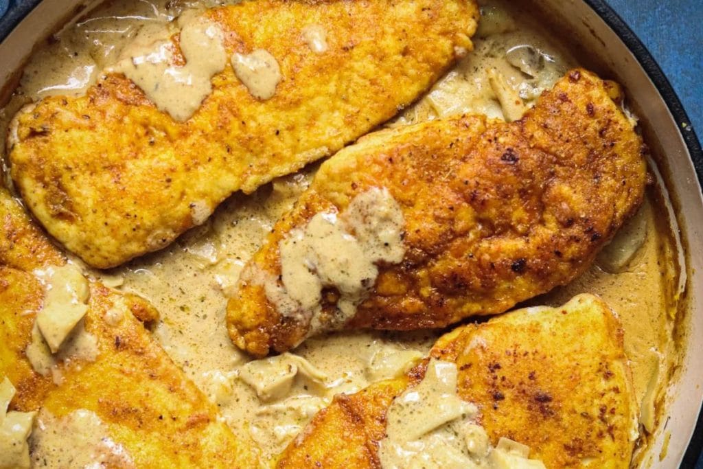 Pan-fried breaded chicken fillets in a creamy sauce offer a delightful dish, perfect for your recipes to make in February.