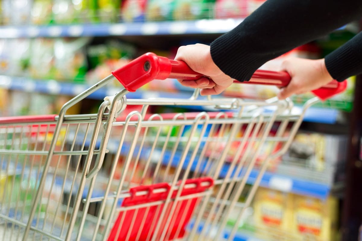 Pushing a shopping cart in a storeGyn9037