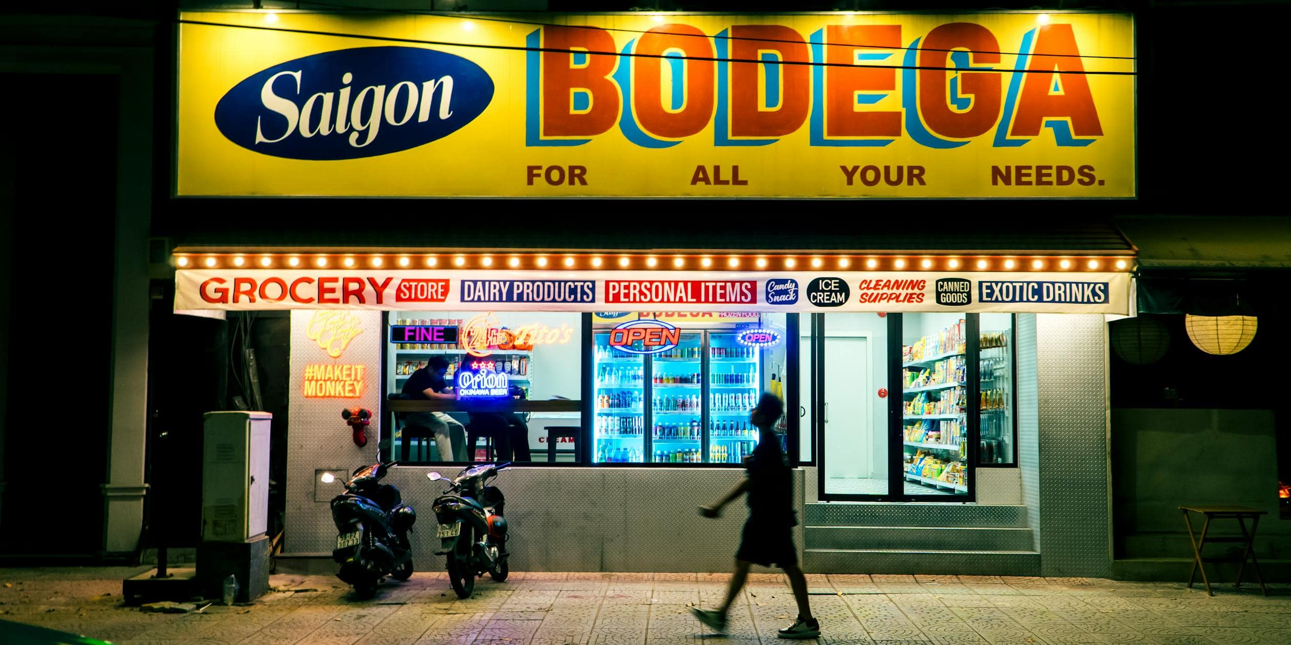 free photo of nighttime scene of illuminated saigon bodega