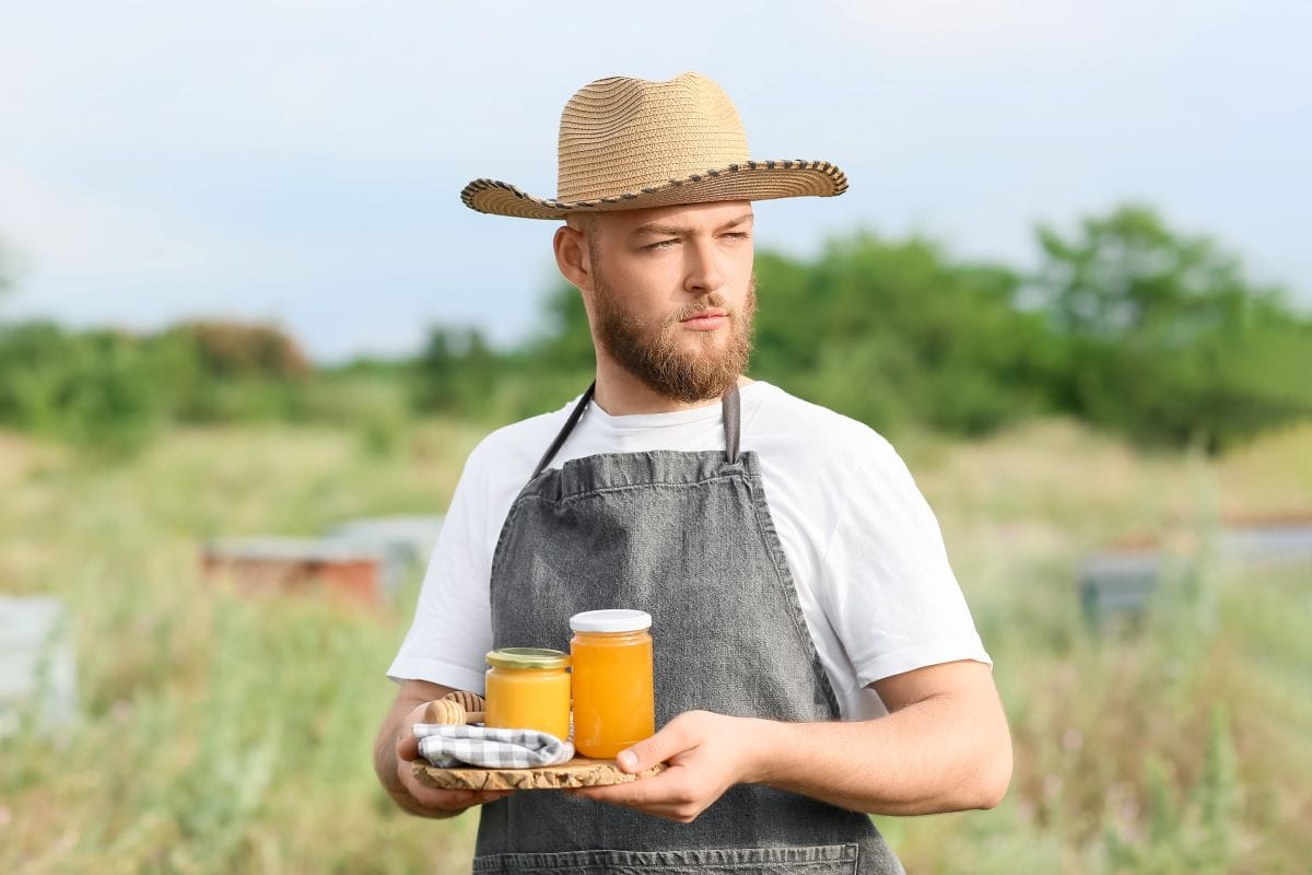 Beekeeper with honeySerezniy 1