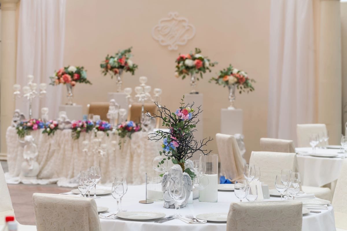 Restaurant with florals and lightsOmstudio