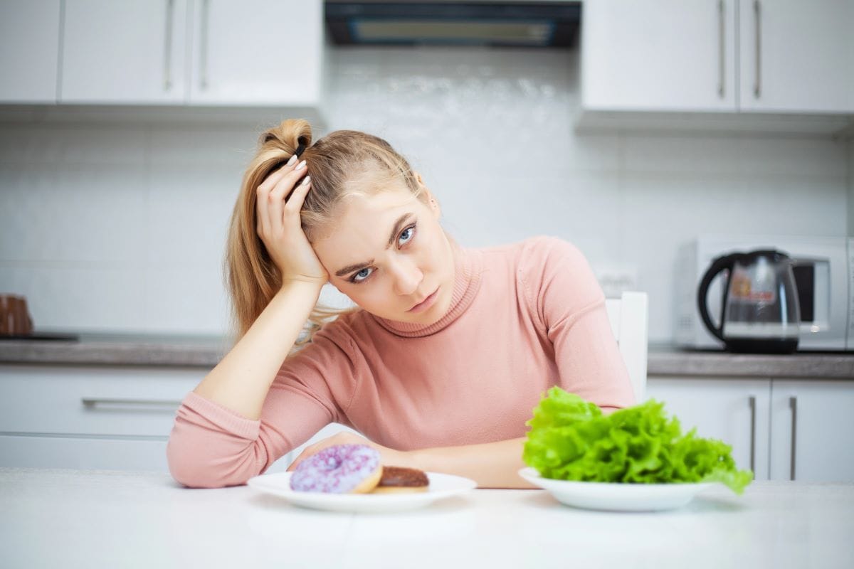 choosing between junk and fruit saladMaksymiv