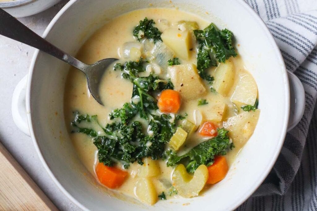 30 Minute Vegan Potato Kale Soup by Bless This Meal