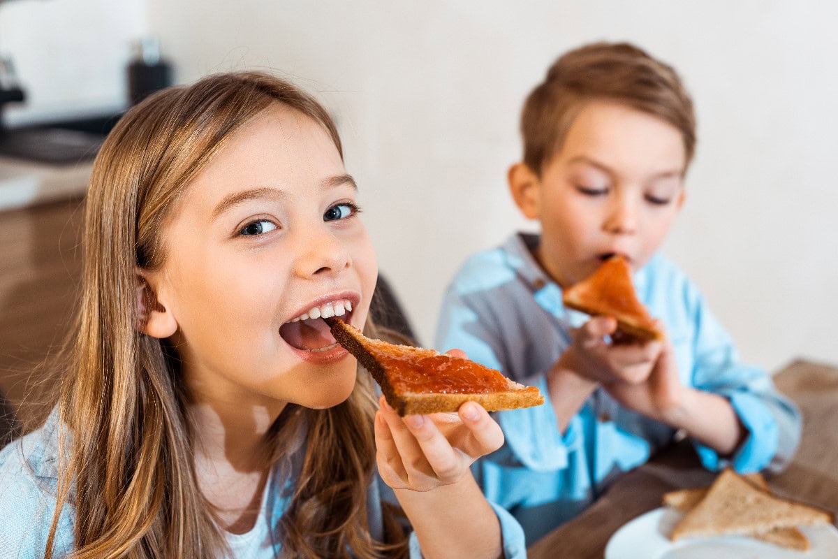 Children eating toast