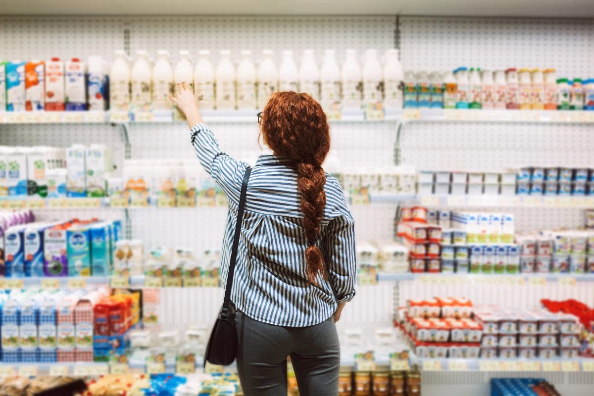 Woman selecting dairy product