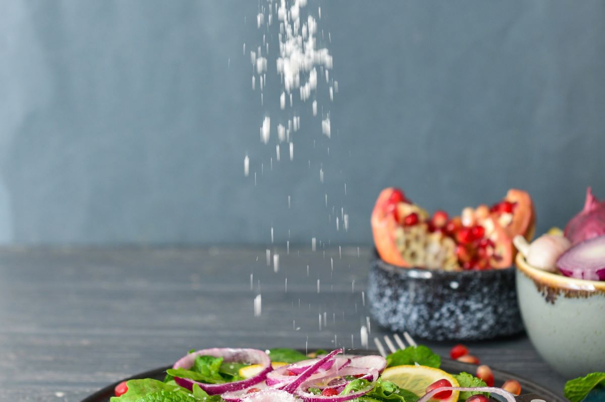 Sprinkling salt on dish