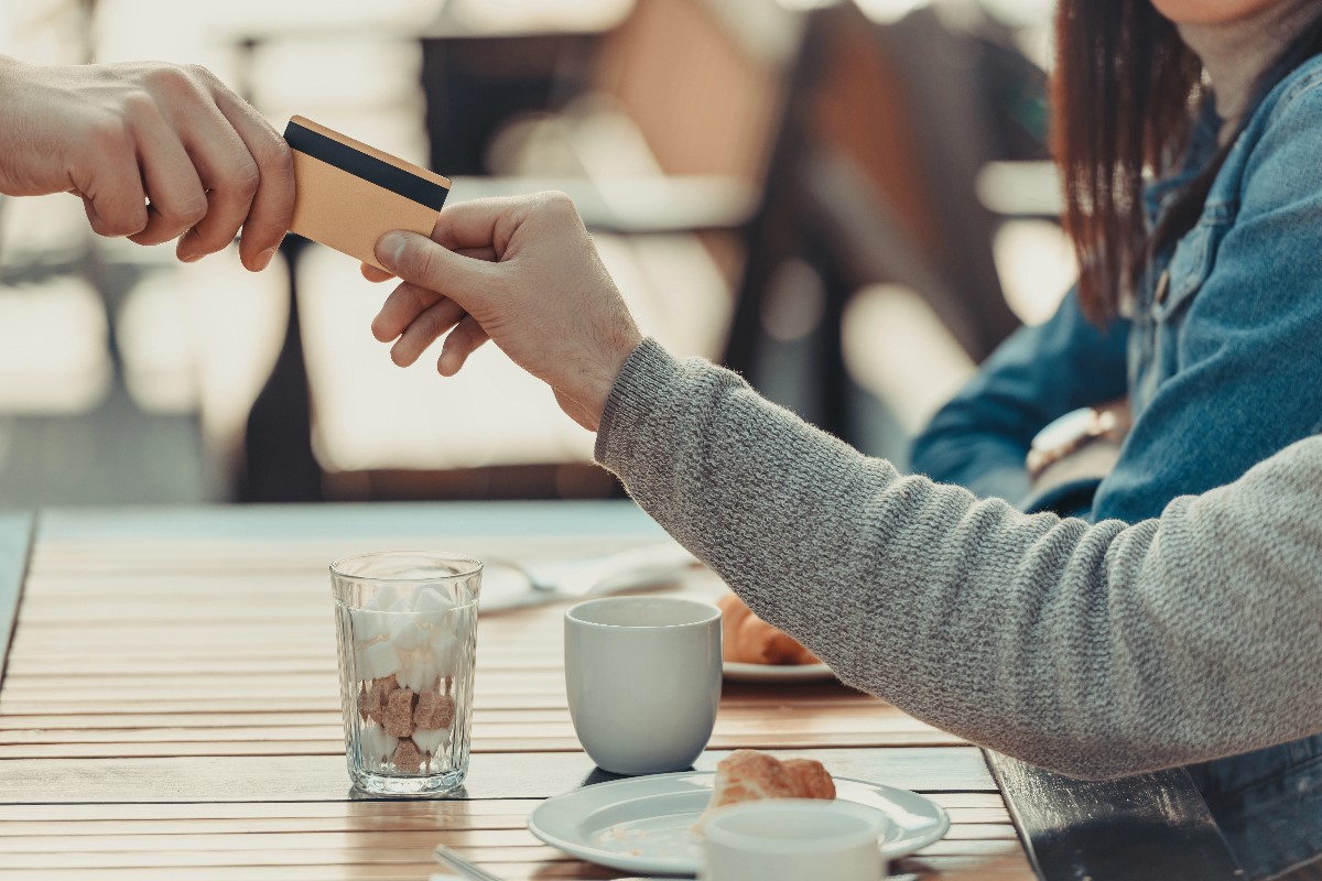 Woman paying in restaurant