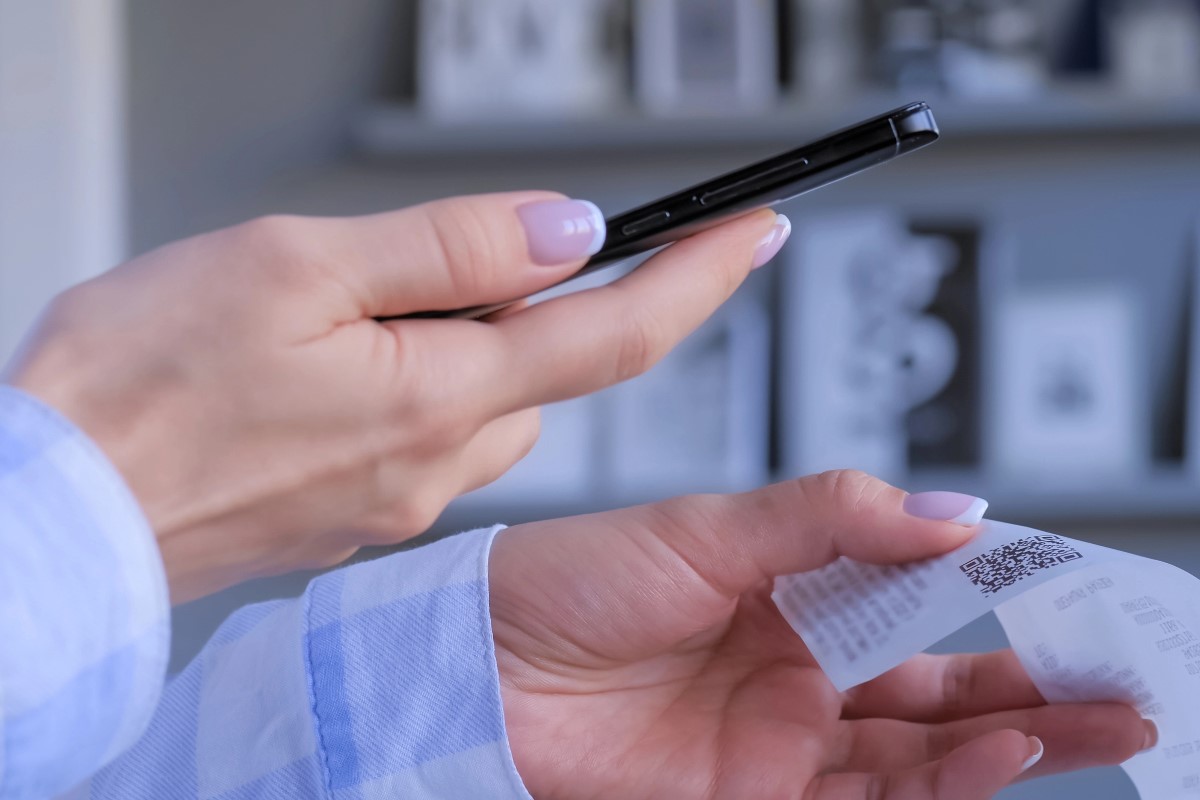Woman scanning receipt