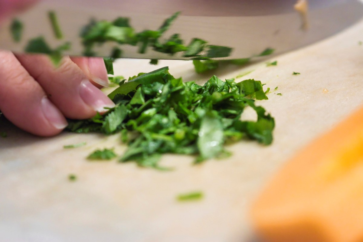 Woman slicing leaves