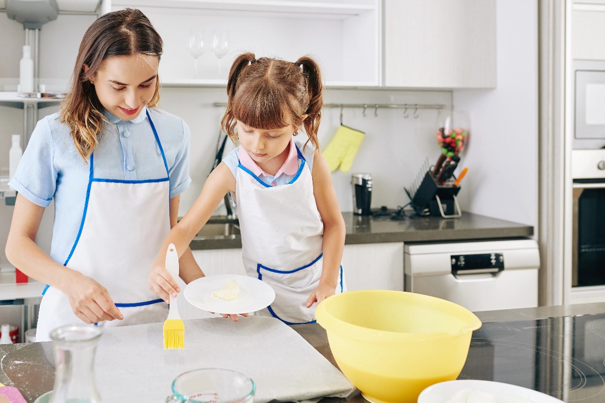 Woman using butter in kitchen