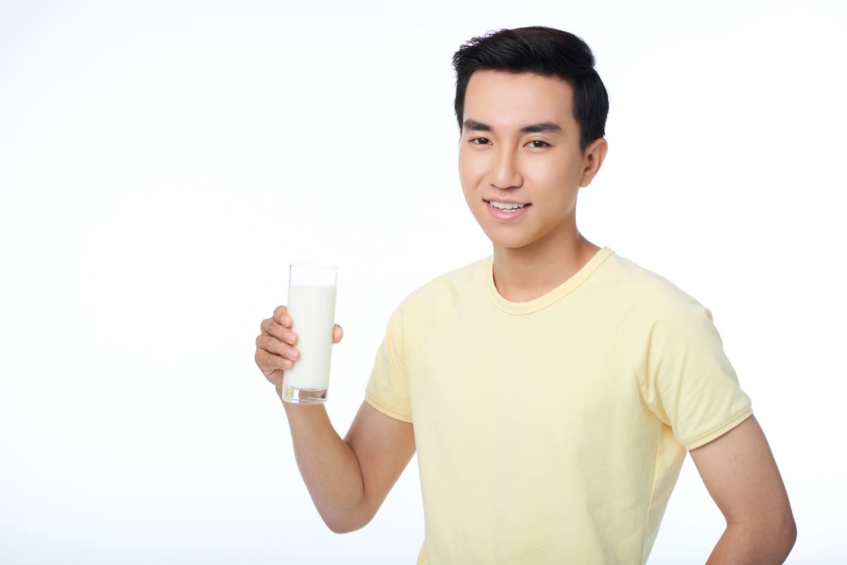 man drinking yoghurt