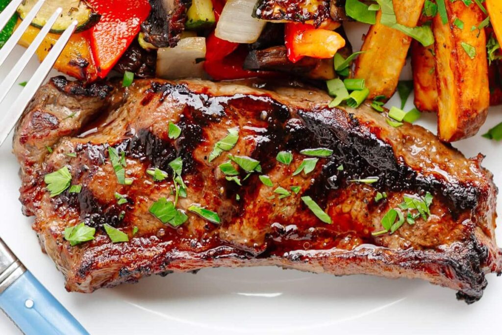 Grilling Marinated Steaks by Maple and Mango