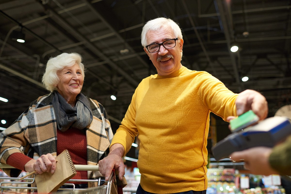 Senior paying discount at grocery store