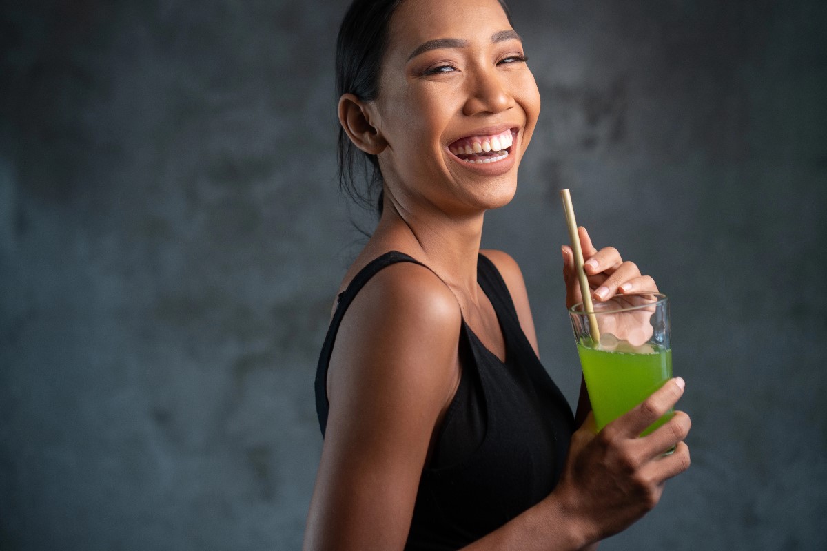 Woman smiling at drink