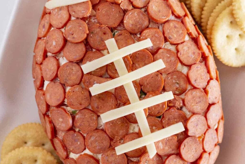 Pepperoni Pizza Football Cheese Ball by Practically Homemade
