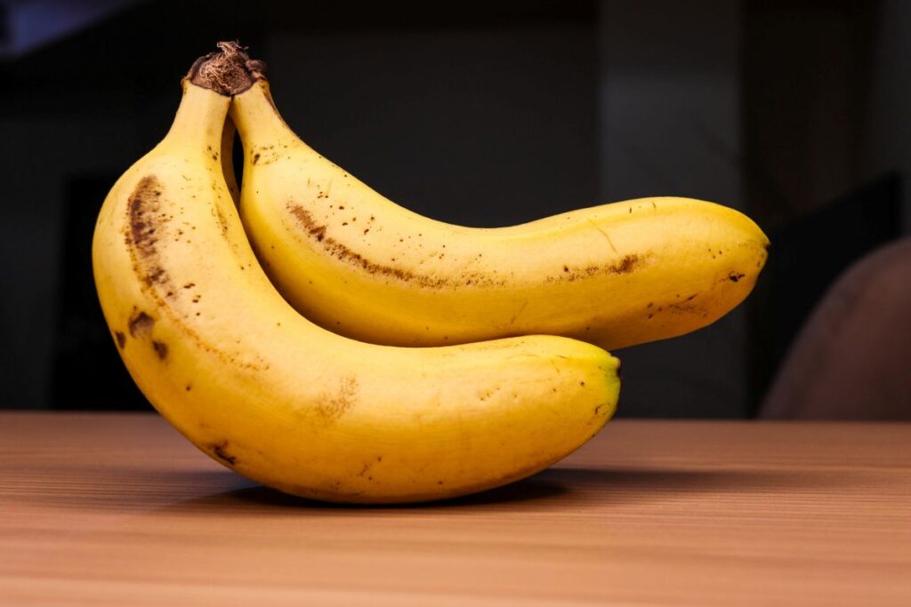 unpeeled bananas